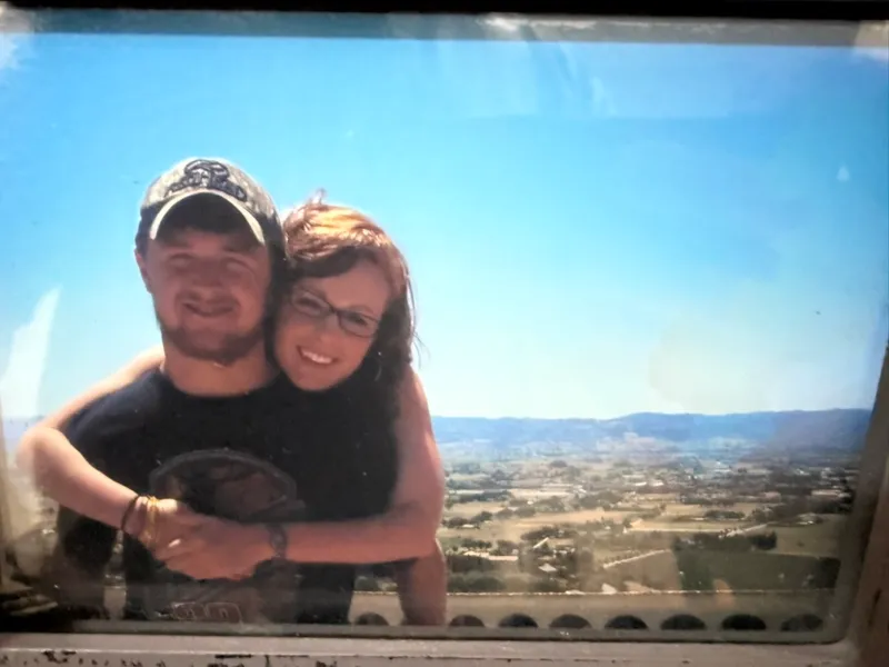 A young Ryan and Brittany at an overlook above the Umbrian valley in Assisi, Italy