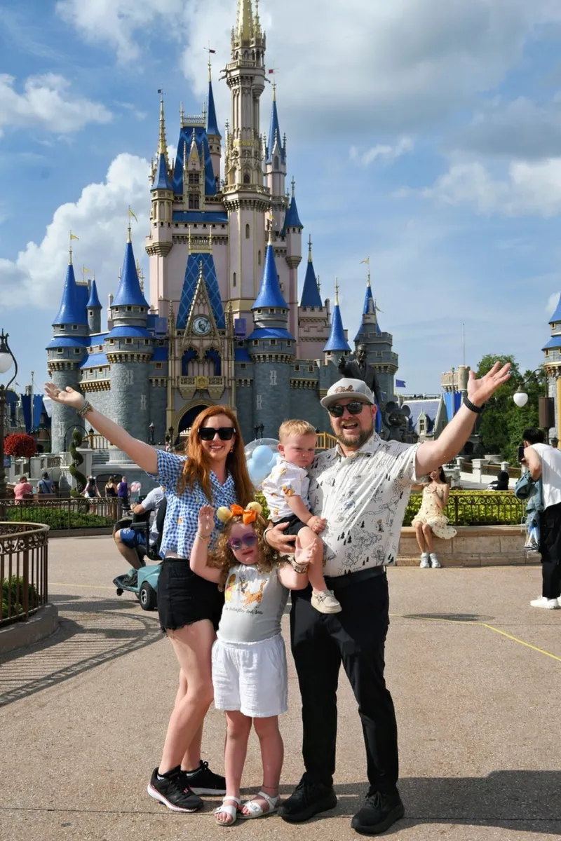 Ryan and Brittany with the kids in front of Cinderella Castle at Walt Disney World